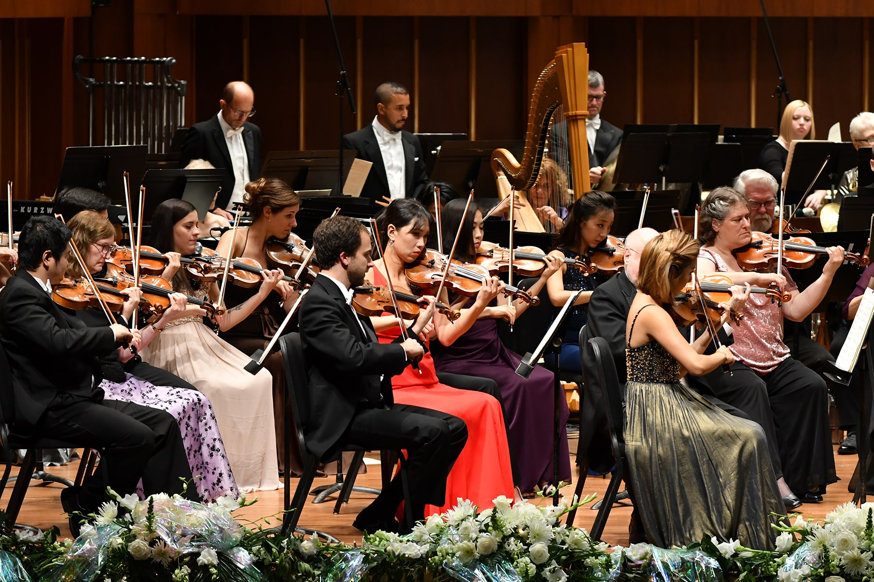 musicians playing in formal dresses and tuxedos