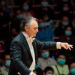 Jun conducting an orchestra